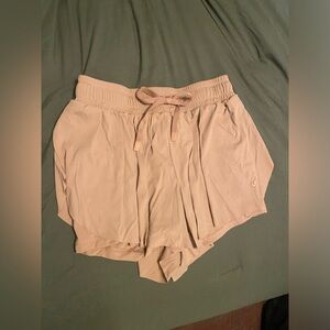 Light brown running shorts.